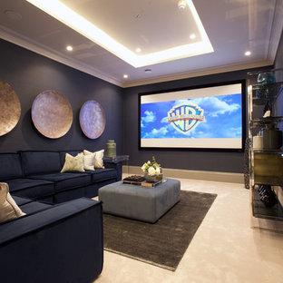 Photo of a medium sized classic enclosed home cinema in Other with blue walls, carpet, a projector screen and beige floors.
