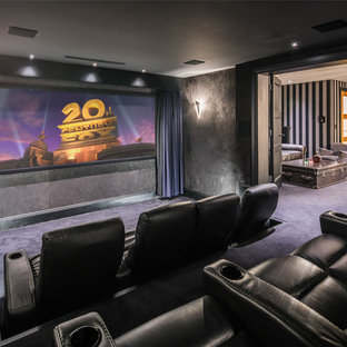 Contemporary enclosed home cinema in London with grey walls, carpet, a wall mounted tv and blue floors.