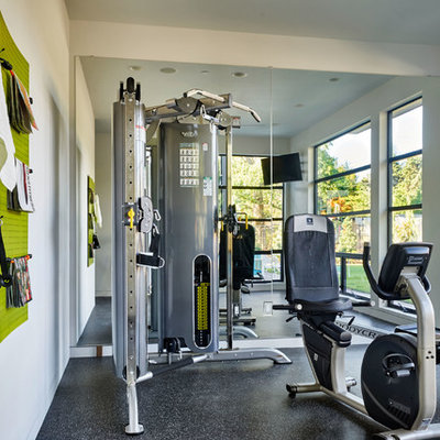 Inspiration for a large contemporary home weight room remodel in Portland with white walls