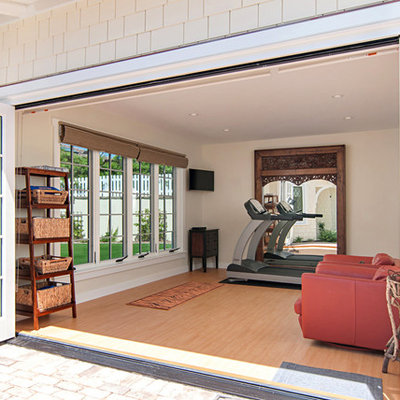 Example of a large classic vinyl floor multiuse home gym design in San Diego with beige walls