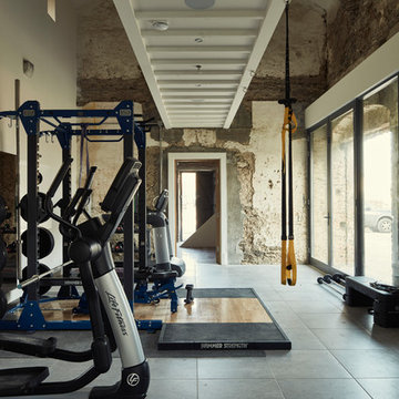 Gym area with gallery mezzanine above, of Coach House