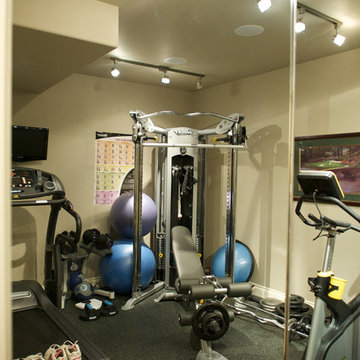 Home Gym.  Storage behind sliding mirrored doors.