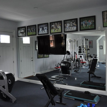 Home Gym with TV Mounted on Glass Wall