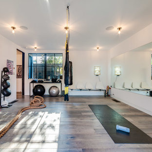 Inspiration for a mid-sized contemporary gray floor and medium tone wood floor multiuse home gym remodel in Los Angeles with white walls
