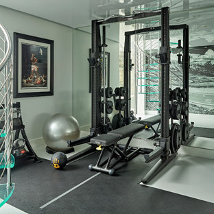 Design ideas for a large contemporary home gym in Hertfordshire with grey walls and grey floors.