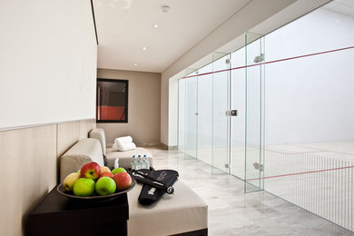 Inspiration for a huge contemporary home gym remodel in London