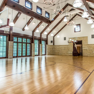 Inspiration for a timeless medium tone wood floor and brown floor indoor sport court remodel in Detroit with white walls
