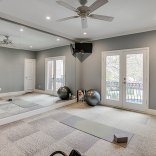 Example of a mid-sized trendy carpeted and beige floor home yoga studio design in Dallas with gray walls