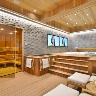 Idee per un'ampia palestra in casa contemporanea con parquet chiaro