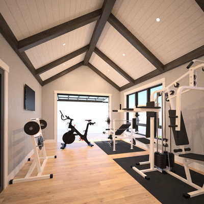 Inspiration for a large contemporary light wood floor home weight room remodel in Other with gray walls