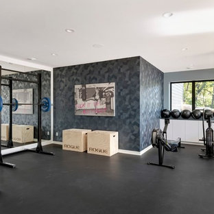 Example of a trendy black floor home gym design in Minneapolis with gray walls