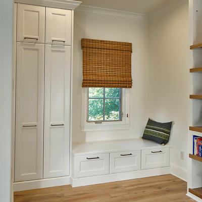 Example of a mid-sized transitional light wood floor and beige floor multiuse home gym design in Dallas with white walls