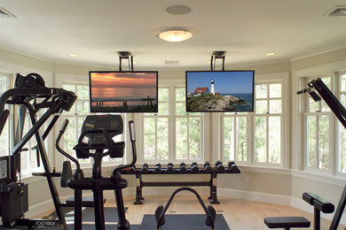 Home weight room - mid-sized contemporary light wood floor and beige floor home weight room idea in Boston with beige walls