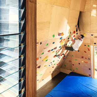 Photo of a contemporary home climbing wall in Brisbane with brown walls and brown floor.