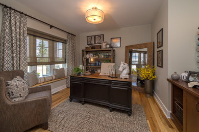 Example of a classic freestanding desk home office design in Boston