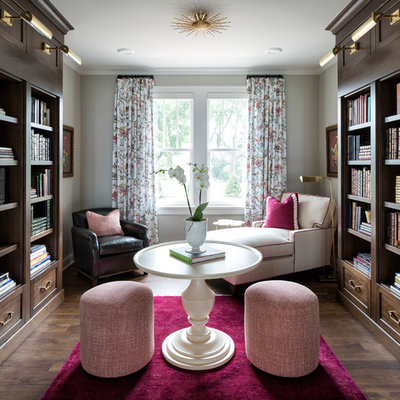 Inspiration for a timeless dark wood floor home office library remodel in Minneapolis with gray walls