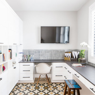 Inspiration for a country built-in desk multicolored floor home office remodel in Seattle with gray walls