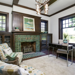 Home office - traditional freestanding desk dark wood floor and brown floor home office idea in Detroit with white walls, a standard fireplace and a tile fireplace