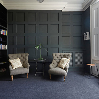 Transitional carpeted study room photo in London with black walls