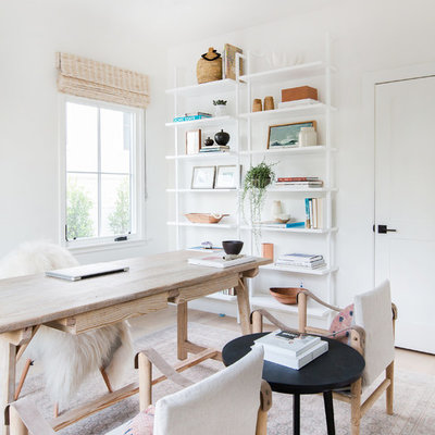Inspiration for a transitional freestanding desk light wood floor home office remodel in San Diego with white walls