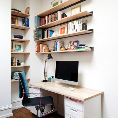 Home office - eclectic freestanding desk medium tone wood floor and brown floor home office idea in Philadelphia with white walls