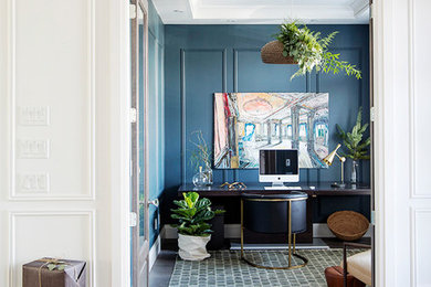 Home office - mid-sized transitional freestanding desk dark wood floor and brown floor home office idea in Vancouver with blue walls and no fireplace