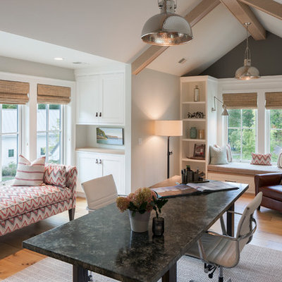 Study room - cottage freestanding desk light wood floor study room idea in Grand Rapids with gray walls and no fireplace