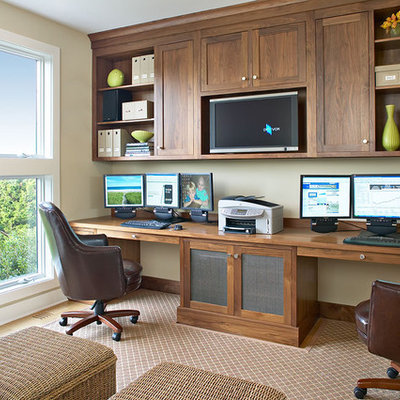 Home office - coastal built-in desk home office idea in New York