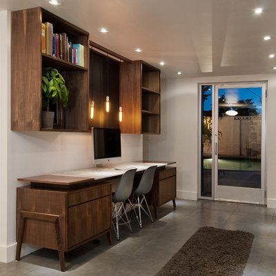Study room - mid-sized contemporary built-in desk gray floor and porcelain tile study room idea in Salt Lake City with white walls and no fireplace