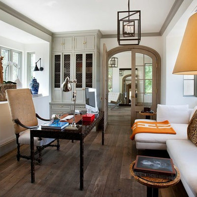 Study room - mediterranean dark wood floor study room idea in Phoenix with white walls