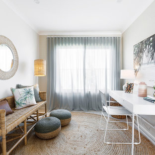 Beach style home office in Melbourne with grey walls and a freestanding desk.