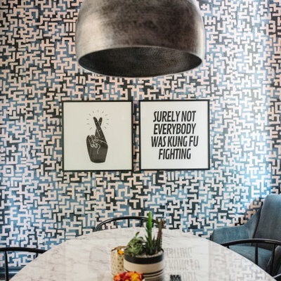 Trendy home office photo in Austin with multicolored walls