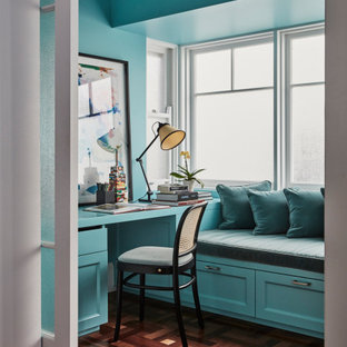 Transitional study room in Newcastle - Maitland with blue walls, medium hardwood floors, no fireplace, a built-in desk and brown floor.