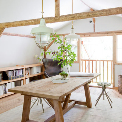Example of a cottage freestanding desk light wood floor and beige floor study room design in Vancouver with white walls