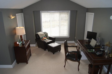 Example of a large classic freestanding desk carpeted study room design in Toronto with gray walls and no fireplace