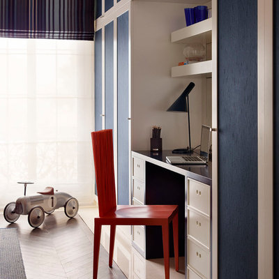 Inspiration for a contemporary built-in desk medium tone wood floor study room remodel in Other