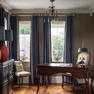 Medium sized classic study in London with grey walls, medium hardwood flooring, a freestanding desk and brown floors.