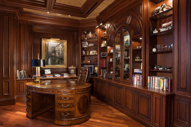 Inspiration for a timeless freestanding desk medium tone wood floor study room remodel in Miami with brown walls