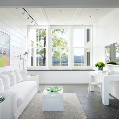 Example of a mid-sized country freestanding desk home office design in New York with white walls and no fireplace