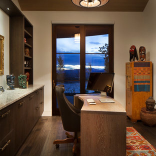 Study room - mid-sized transitional freestanding desk dark wood floor and brown floor study room idea in Denver with beige walls and no fireplace