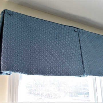 Box pleat valances enhanced with covered buttons in a quiet study