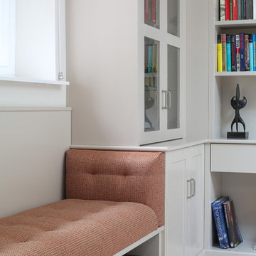 Brentwood library, sliding ladder, cabinets, seating and radiator cabinet.