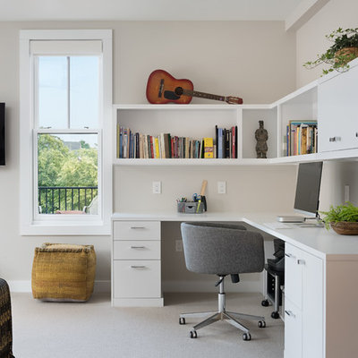 Home office - mid-sized contemporary built-in desk carpeted and beige floor home office idea in Portland Maine with beige walls