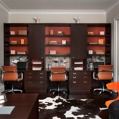 Study room - mid-sized contemporary built-in desk dark wood floor study room idea in Detroit with beige walls and no fireplace