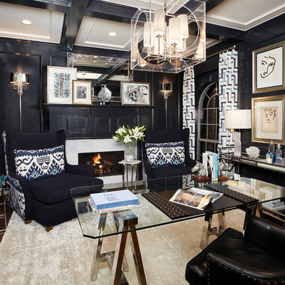 Home office - traditional freestanding desk dark wood floor home office idea in Dallas with black walls and a standard fireplace