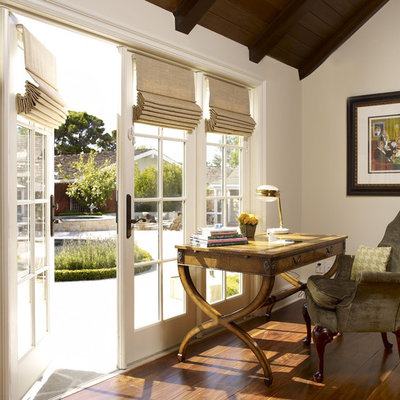 Inspiration for a small timeless freestanding desk medium tone wood floor study room remodel in Los Angeles with white walls and no fireplace