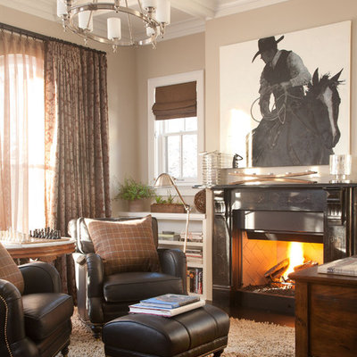 Example of a classic freestanding desk dark wood floor home office design in Denver with beige walls and a standard fireplace