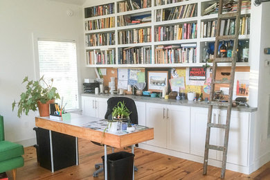 Example of a beach style home office design in Other