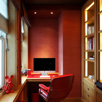 Inspiration for a mid-sized timeless built-in desk dark wood floor and brown floor study room remodel in London with red walls