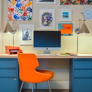 Mid-sized trendy freestanding desk carpeted and brown floor study room photo in DC Metro with beige walls